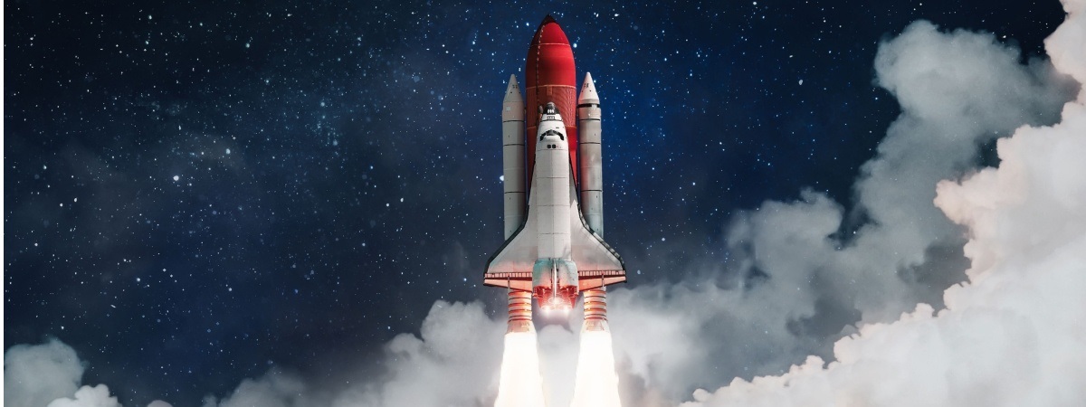 Space shuttle rocket launch in the clouds with stars to outer space-Shutterstock_2057170763